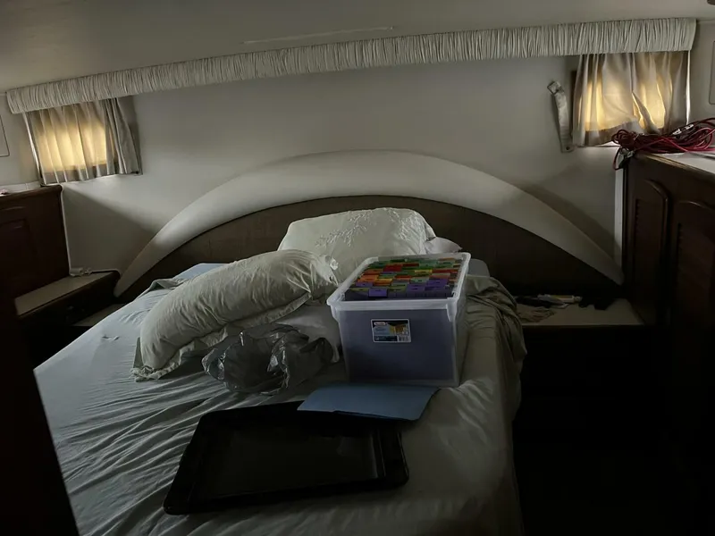 Slide: The Image of Interior cabin of 1987 Californian 42 Motor Yacht with bed and storage items. - 20