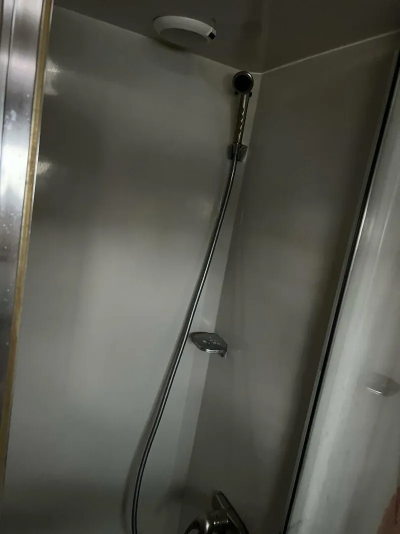 Slide: The Image of Shower area in 1987 Californian 42 Motor Yacht, featuring modern fixtures. - 24