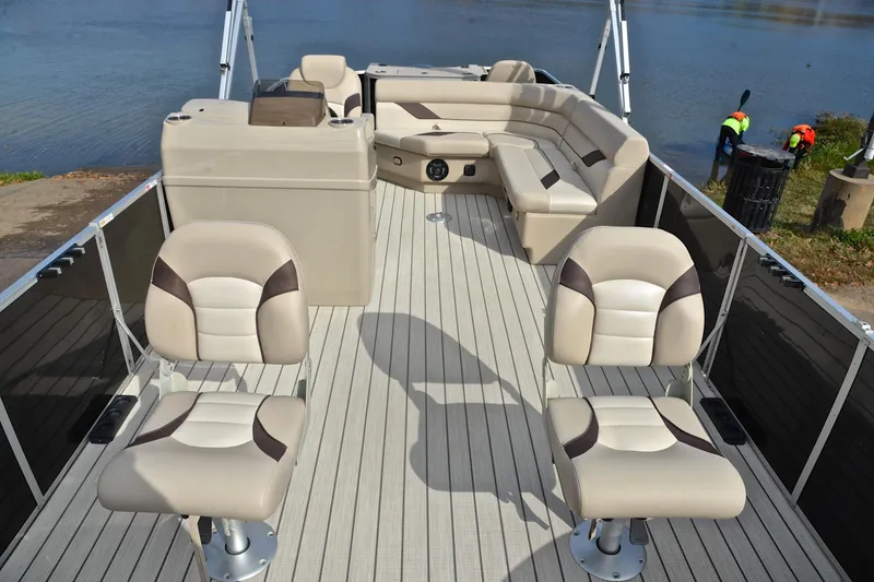 Slide: The Image of 2023 SunCatcher Select 22F pontoon boat with beige seating and spacious deck layout. - 20