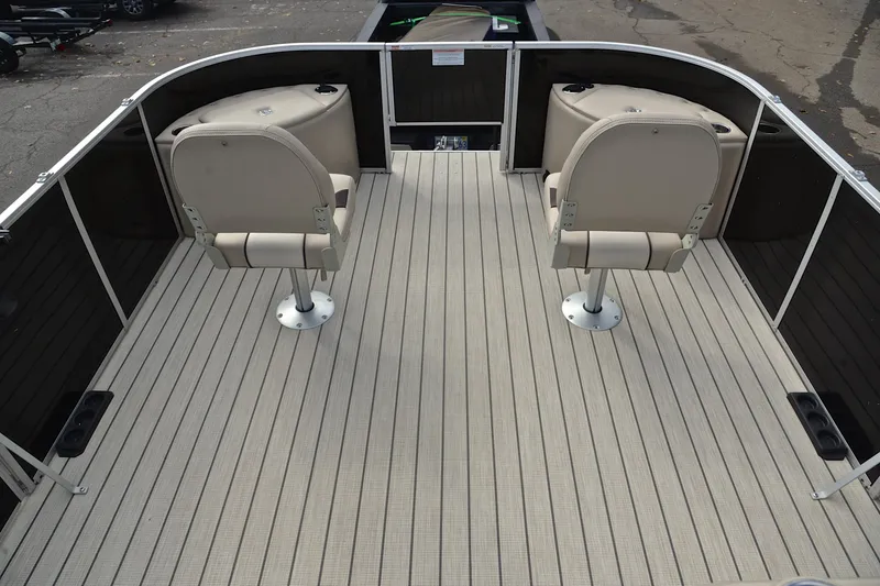 Slide: The Image of 2023 SunCatcher Select 22F pontoon boat deck with two beige swivel seats. - 21