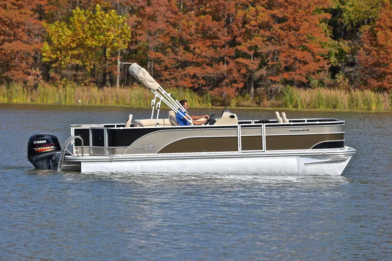 Slide: The Image of 2023 SunCatcher Select 22F pontoon boat cruising on a lake with autumn trees. - 6