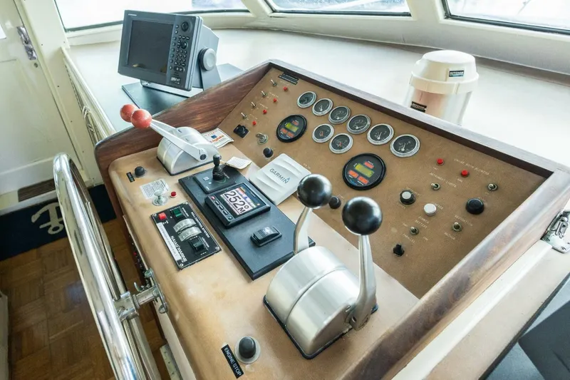 Slide: The Image of Control panel of a 1987 Hatteras 70 Cockpit Motor Yacht with navigation equipment. - 15