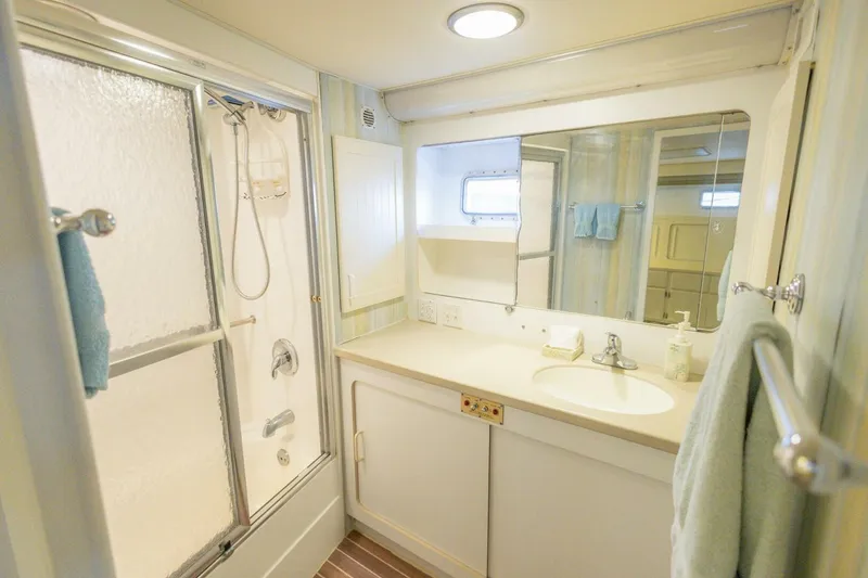 Slide: The Image of Bathroom interior of 1987 Hatteras 70 Cockpit Motor Yacht with shower and vanity. - 22
