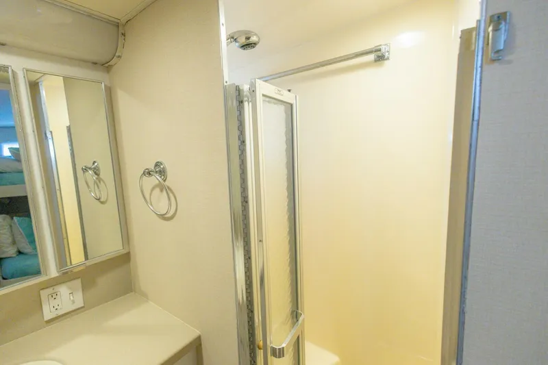 Slide: The Image of Bathroom interior of 1987 Hatteras 70 Cockpit Motor Yacht with shower and mirror. - 27