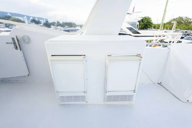 Slide: The Image of 1987 Hatteras 70 Cockpit Motor Yacht deck with storage compartments. - 35