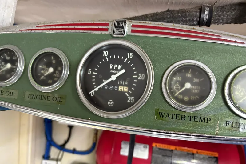 Slide: The Image of Instrument panel of a 1987 Hatteras 70 Cockpit Motor Yacht showing RPM and gauges. - 54