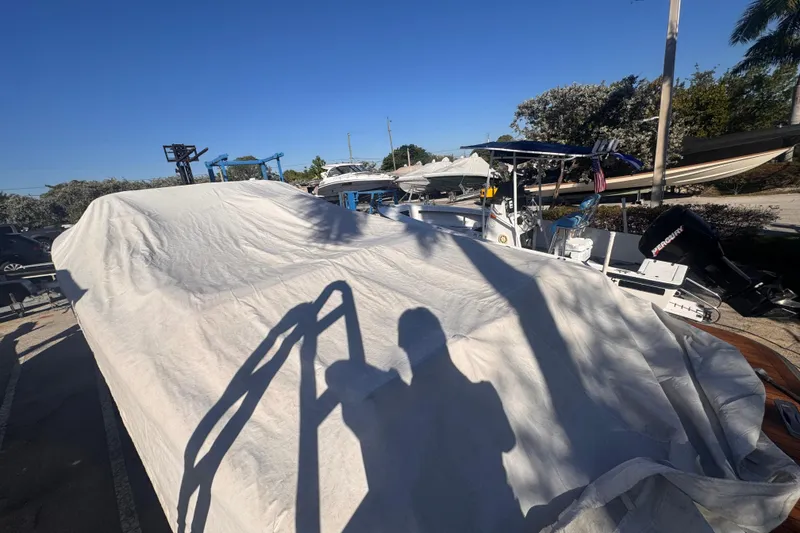 Slide: The Image of Covered 2014 Chris-Craft Launch 28 boat in a sunny outdoor storage area. - 3