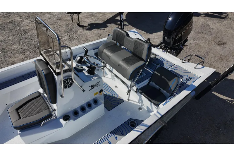 Slide: The Image of 2026 Xpress H22B Bay boat interior with seating and steering console. - 10