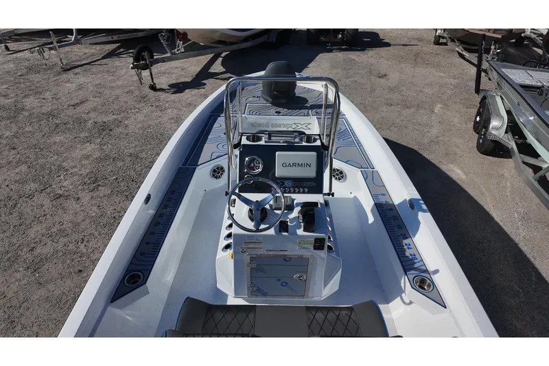 Slide: The Image of 2026 Xpress H22B Bay boat with Garmin navigation system, featuring sleek design and modern controls. - 13