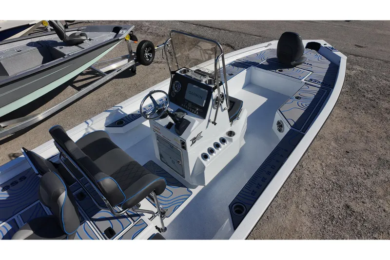Slide: The Image of 2026 Xpress H22B Bay boat with modern console and seating, parked on a trailer. - 6