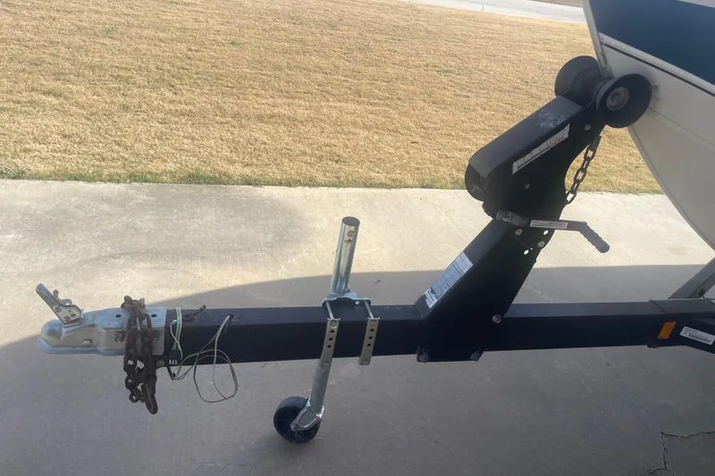 Slide: The Image of Trailer hitch of a 1997 Lowe Classic 257 boat on concrete driveway. - 7