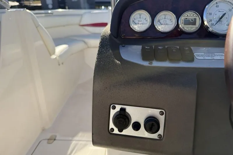 Slide: The Image of Dashboard of a 2006 Regal 2000 boat with gauges and controls. - 15