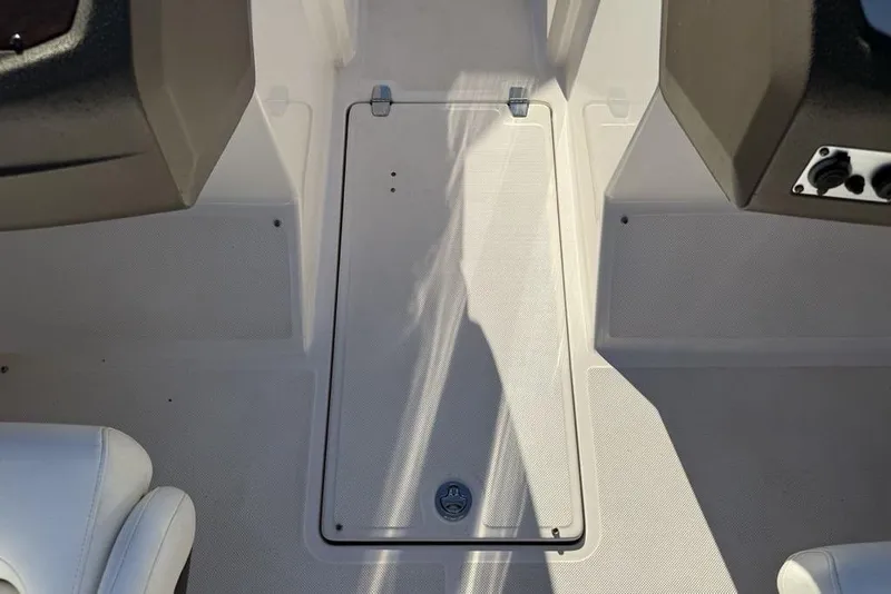 Slide: The Image of Boat interior floor hatch on a 2006 Regal 2000 model. - 16