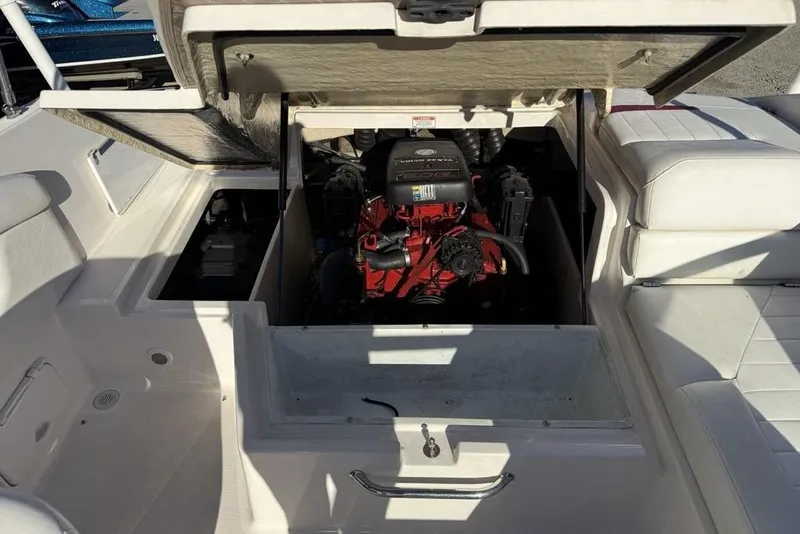 Slide: The Image of Open engine compartment of a 2006 Regal 2000 boat, showcasing the engine details. - 20
