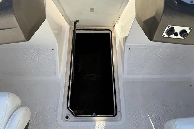 Slide: The Image of Open storage compartment on a 2006 Regal 2000 boat deck. - 21