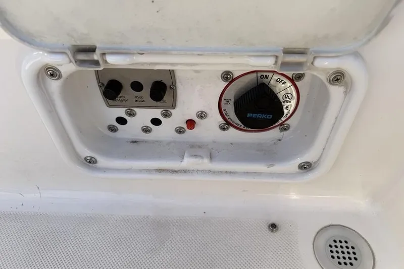 Slide: The Image of Control panel of a 2006 Regal 2000 boat with Perko switch and bilge controls. - 22