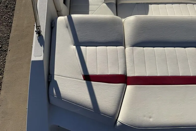 Slide: The Image of White and red boat seating on a 2006 Regal 2000 model. - 23