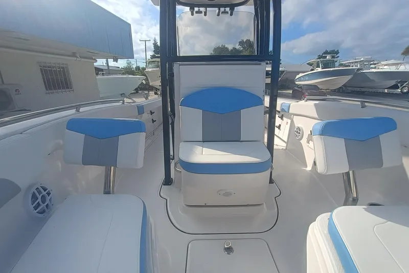 Slide: The Image of 2026 Robalo R222 Center Console boat interior with blue and white seating. - 22
