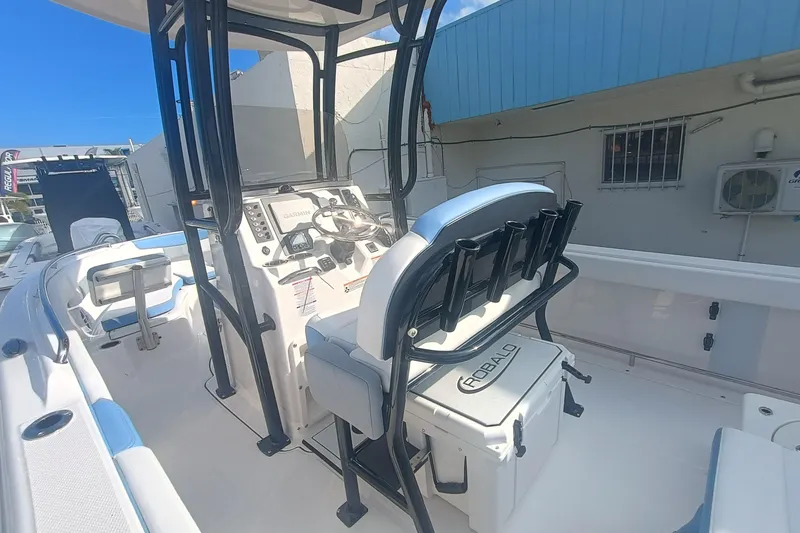 Slide: The Image of 2026 Robalo R222 Center Console boat interior with steering and seating. - 27