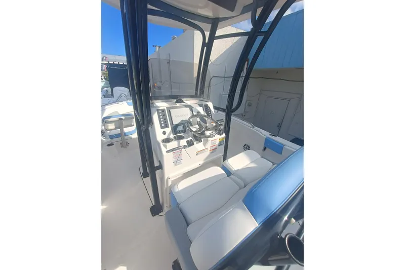 Slide: The Image of 2026 Robalo R222 Center Console boat interior with steering wheel and seating. - 31
