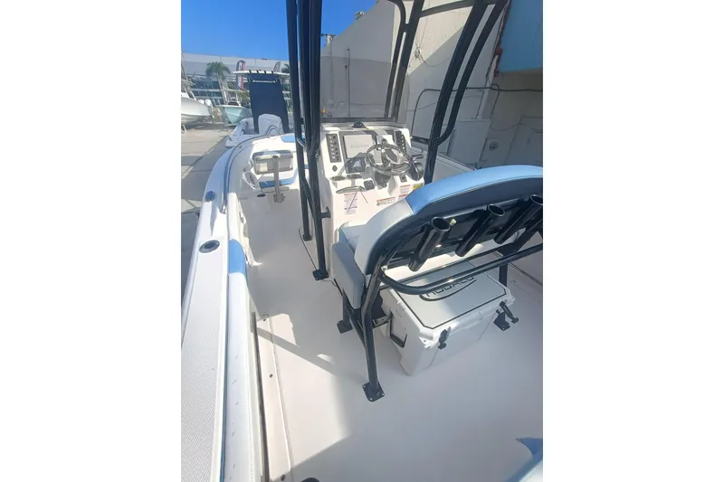 Slide: The Image of 2026 Robalo R222 Center Console boat interior with steering console and seating. - 33