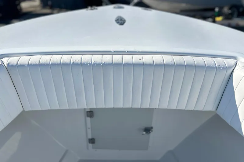 Slide: The Image of 1991 Contender 25 Open boat interior with white cushioned seating. - 14