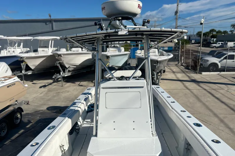 Slide: The Image of 1991 Contender 25 Open boat with radar, docked among other vessels. - 17