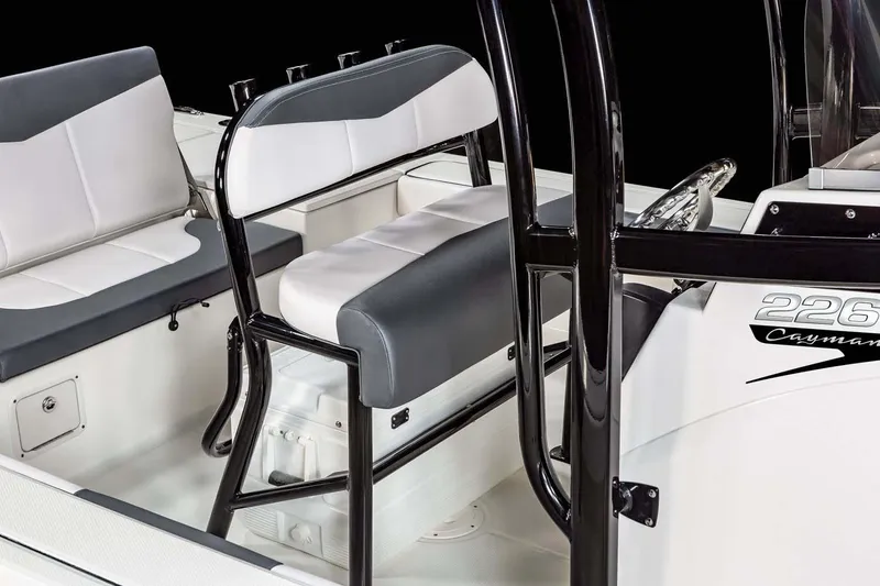 Slide: The Image of 2026 Robalo 226 Cayman boat interior with blue canopy and storage compartment. - 11