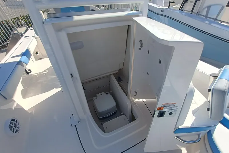 Slide: The Image of 2026 Robalo 226 Cayman boat interior with open storage compartment. - 21