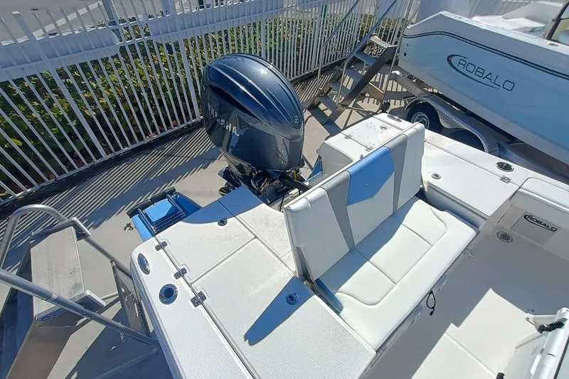 Slide: The Image of 2026 Robalo 226 Cayman boat with Yamaha outboard engine, white seating, and sleek design. - 22
