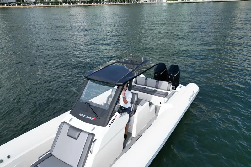 Slide: The Image of 2026 Northstar ORION 10 boat on water, featuring sleek design and modern amenities. - 5
