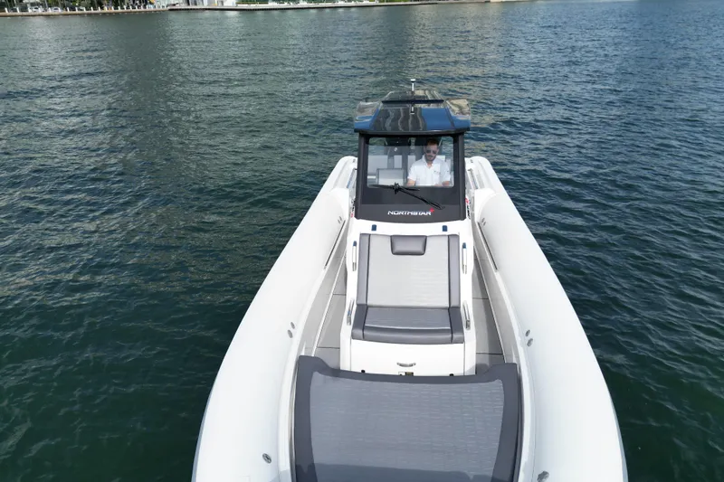 Slide: The Image of 2026 Northstar ORION 10 boat cruising on calm waters, top view. - 9