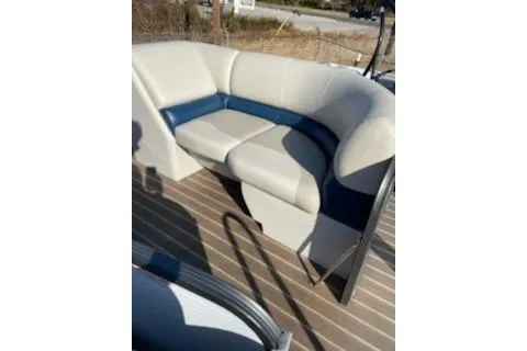 Slide: The Image of 2017 Manitou 22 Aurora LE Standard boat seating, beige and blue upholstery. - 3