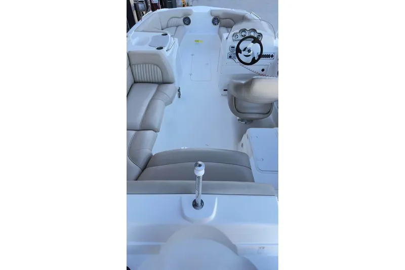 Slide: The Image of 2013 NauticStar 203 SC boat interior with seating and steering console. - 8