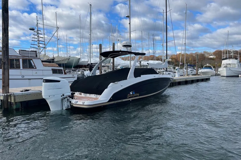 Slide: The Image of 2016 Four Winns HD270 OB boat docked at marina, covered and ready for use. - 3
