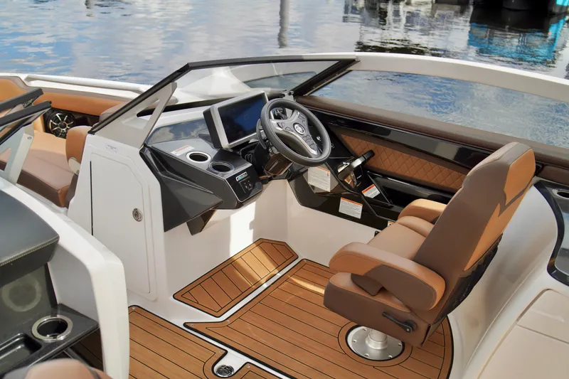 Slide: The Image of 2025 Yamaha Boats 275SD cockpit with luxurious seating and modern dashboard design. - 14