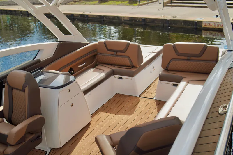 Slide: The Image of 2025 Yamaha Boats 275SD interior with luxurious seating and sleek design. - 24