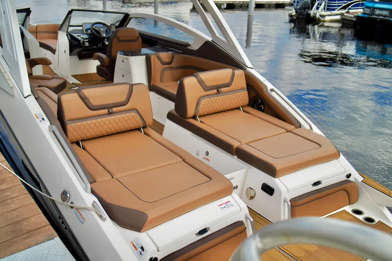 Slide: The Image of 2025 Yamaha Boats 275SD interior with luxurious tan seating and modern design. - 26