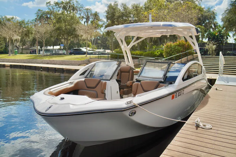 Slide: The Image of 2025 Yamaha Boats 275SD docked, showcasing sleek design and modern features. - 9