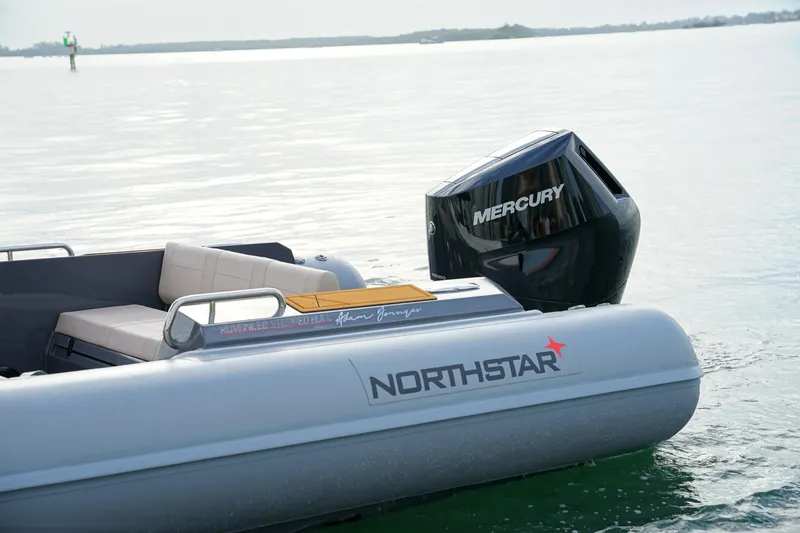 Slide: The Image of 2026 Northstar Orion 8 boat with Mercury engine on calm water. - 11