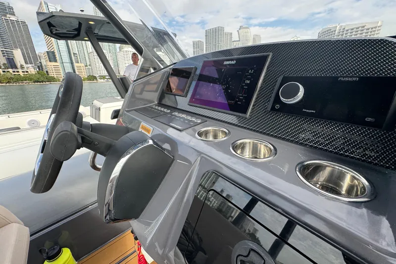 Slide: The Image of 2026 Northstar Orion 8 boat dashboard with modern controls and city skyline background. - 21