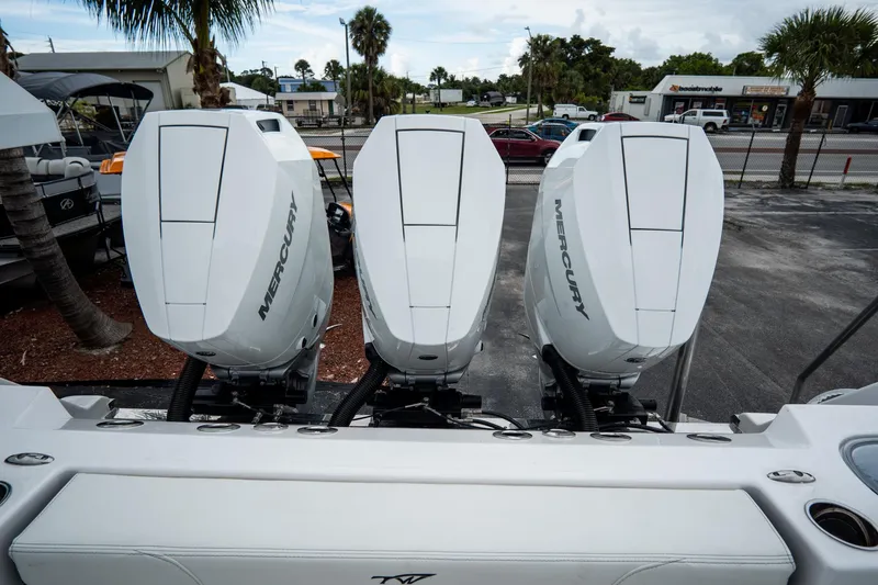 Slide: The Image of 2023 Tidewater 380 CC Adventure boat docked, top view showcasing deck and equipment. - 10