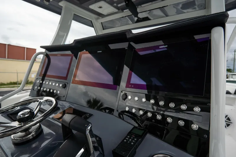 Slide: The Image of 2023 Tidewater 380 CC Adventure boat with speakers and storage compartment. - 22