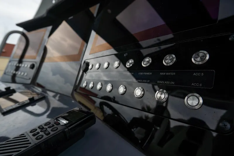 Slide: The Image of 2023 Tidewater 380 CC Adventure boat deck with open storage compartments. - 23