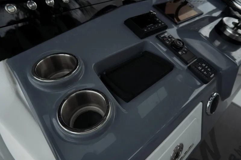 Slide: The Image of 2023 Tidewater 380 CC Adventure boat interior with livewell and seating area. - 25