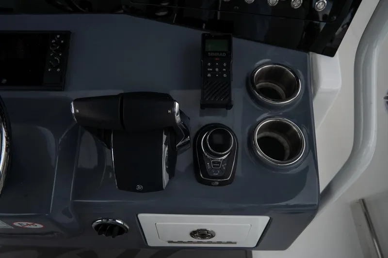 Slide: The Image of 2023 Tidewater 380 CC Adventure boat deck with outboard motors and sleek design. - 27