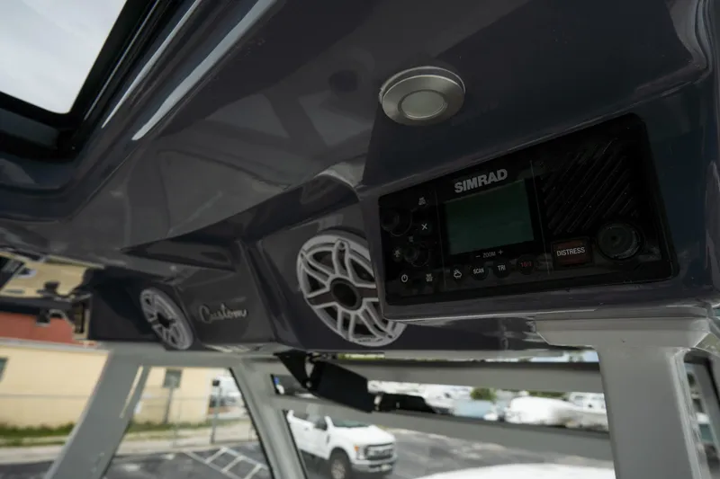 Slide: The Image of 2023 Tidewater 380 CC Adventure boat interior detail with latch and storage compartment. - 28