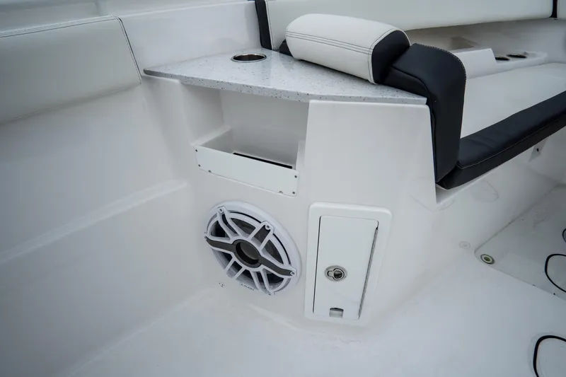 Slide: The Image of 2023 Tidewater 380 CC Adventure boat interior with luxury seating and helm controls. - 39