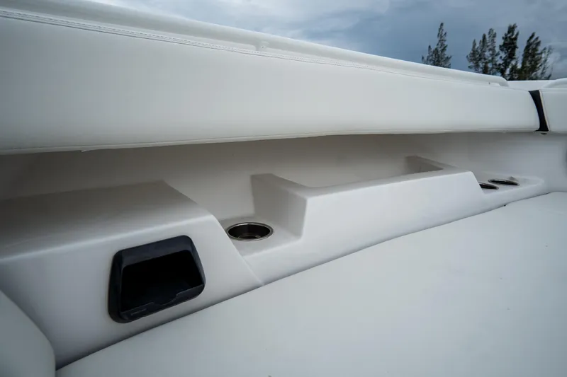 Slide: The Image of 2023 Tidewater 380 CC Adventure boat interior with luxury seating and control panel. - 40