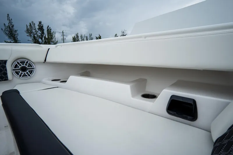 Slide: The Image of 2023 Tidewater 380 CC Adventure boat seats with black and white upholstery, featuring armrests. - 41